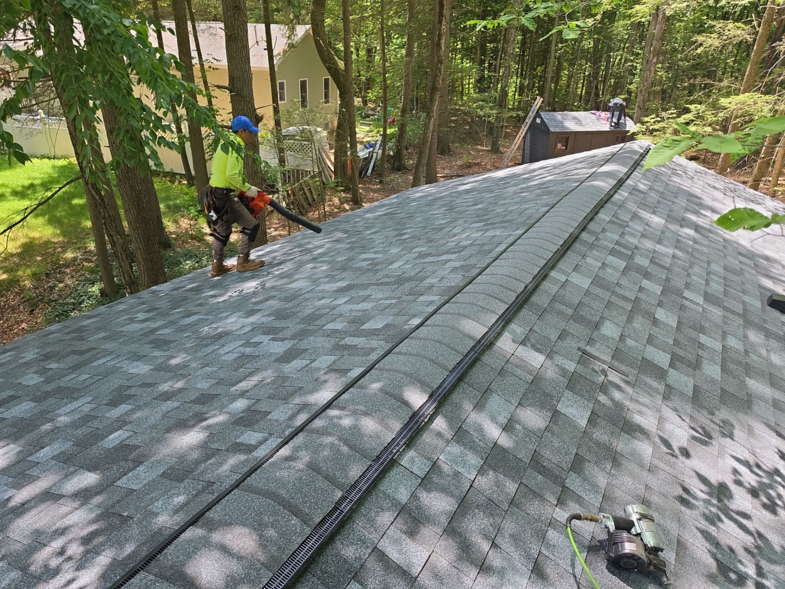 Owens Corning TruDefinition Duration architectural shingles on a wooded New England roof
